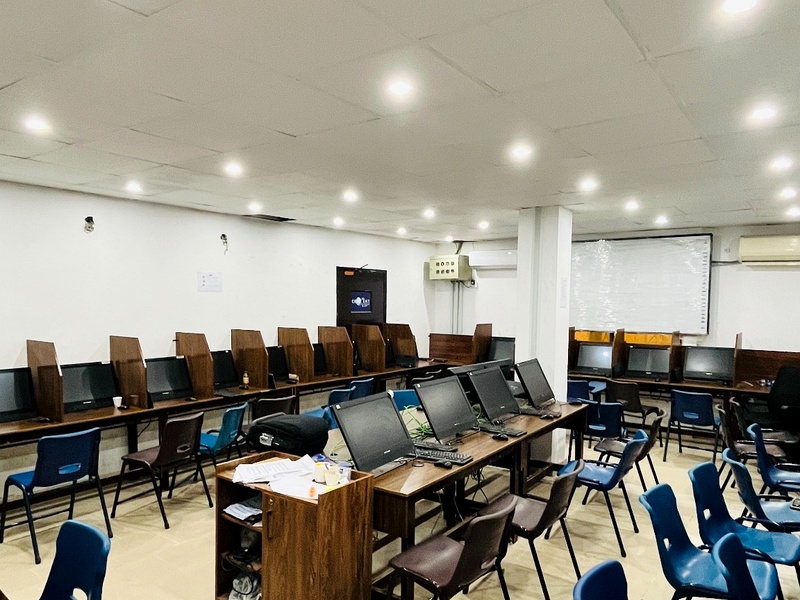 Crescent College computer lab with desktop systems and study seating