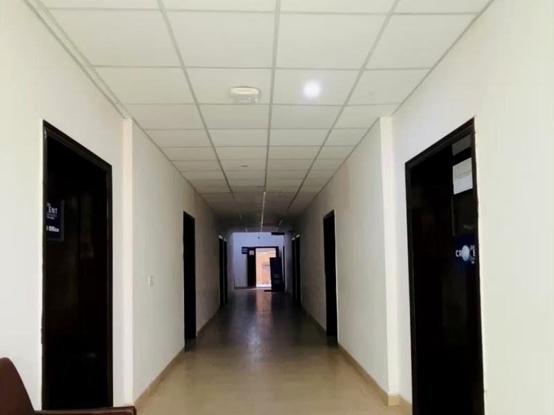 Crescent College corridor with classroom doors and lighting