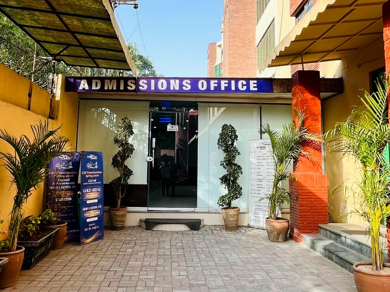 Crescent College admissions office entrance with plants